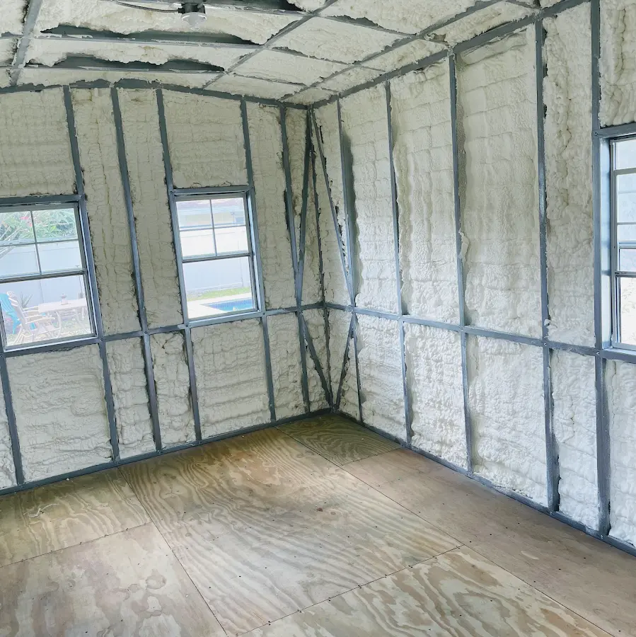 Closed-cell spray foam insulation applied to wall cavities in a residential project in Country Walk